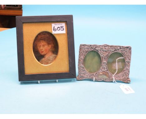 An Edward VII silver double photograph frame, embossed with leafage, Birmingham 1902, 4.5 x 6.25in., and a small oil portrait