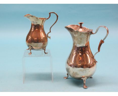 A silver hot water jug, Sheffield 1912, and near-matching silver milk jug, approx. 28oz. total 