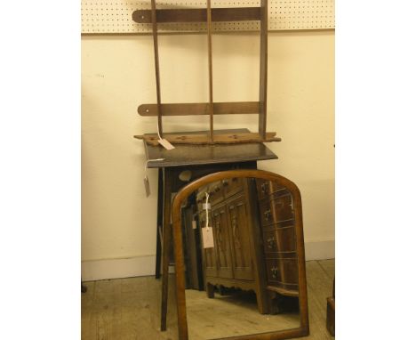 A dark oak two-tiered plant table, 8in., a Victorian mahogany wall mirror, and a three-shelf wall-hanging book-rack