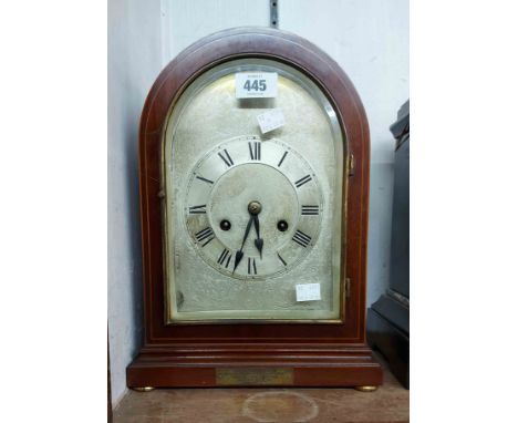 An Edwardian mahogany and strung dome cased mantel clock with silvered dial and eight day gong striking movement