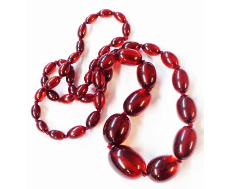 A vintage red amber graduated bead necklace