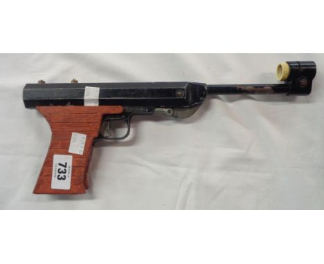 A vintage Italian air pistol with later replacement handle
