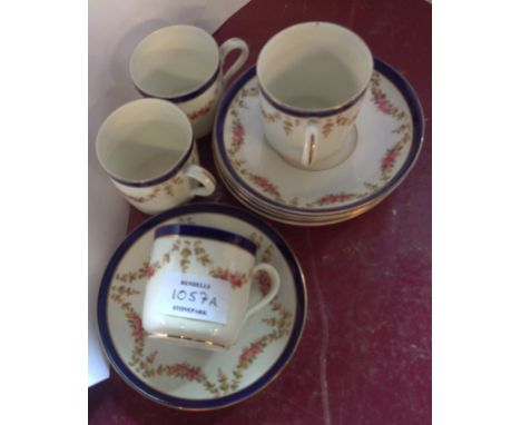 A set of four Tuscan China coffee cups and saucers with transfer-printed floral swag decoration - sold with two extra saucers