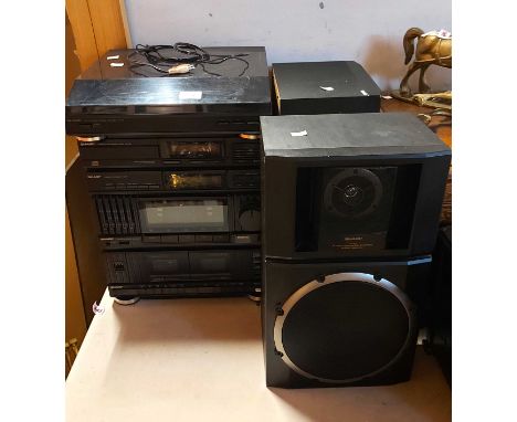 A Sharp Hi Fi system with speakers consisting of turntable, CD player, tuner, amplifier and tape deck