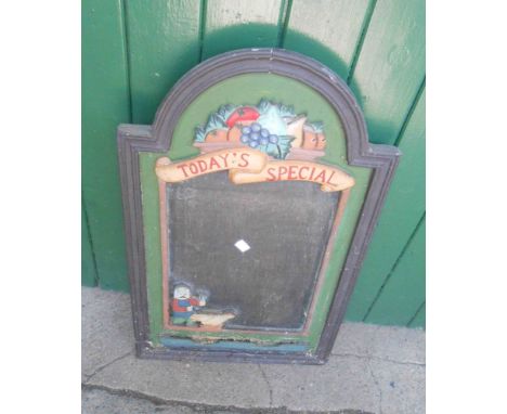 A vintage 'Today's Special' sign within a decorative border depicting a bowl of fruit