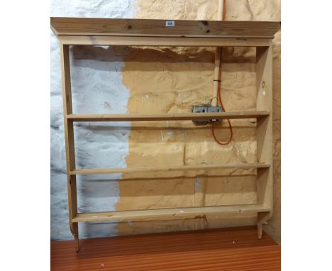 A 1.08m modern pine wall mounted three shelf open plate rack