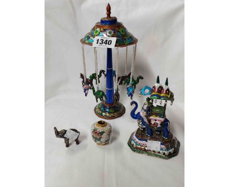 A vintage Eastern enamel on white metal and copper model of a fairground merry-go-round, a similar model depicting an elephan