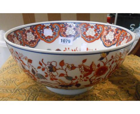 A modern Chinese porcelain bowl with iron red enamel decoration