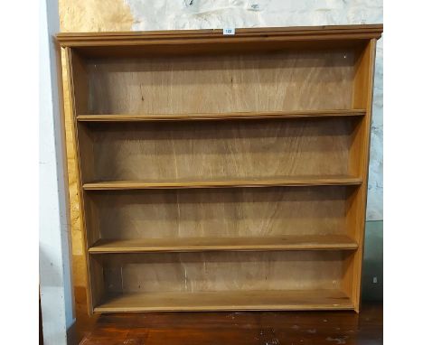 A 1.14m modern pine four shelf open bookcase