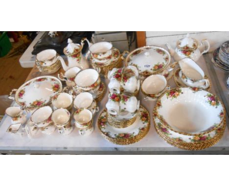 A large quantity of Royal Albert bone china tea and dinner ware decorated in the Old Country Roses pattern including vegetabl