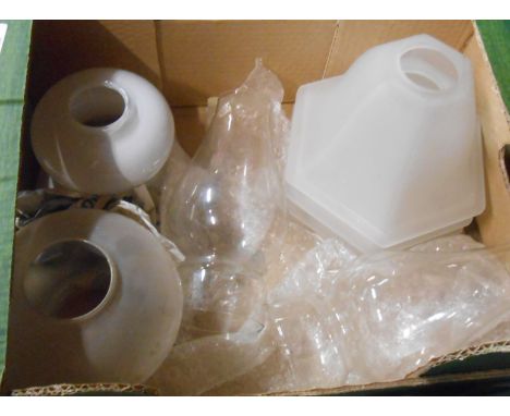 A box containing a quantity of glass lampshades including frosted hanging ceiling shades, oil lamp chimneys, etc.