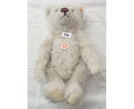 A vintage Steiff Classic Teddy bear with white mohair, button to ear and tags and internal growler