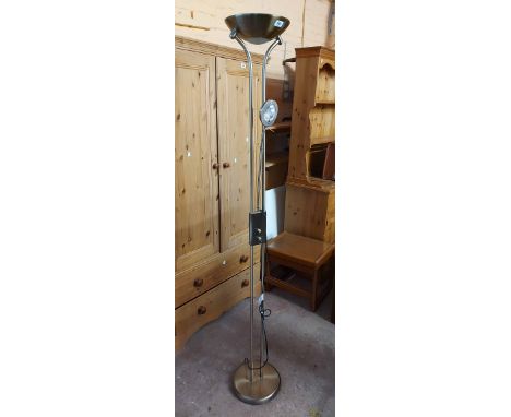 A modern antiqued brass effect uplighter standard lamp with poseable reading lamp and circular base