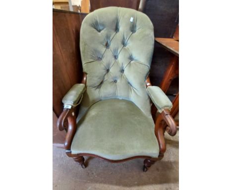 A Victorian mahogany part show frame drawing room armchair with button back pale green velour upholstery and scroll armrest t