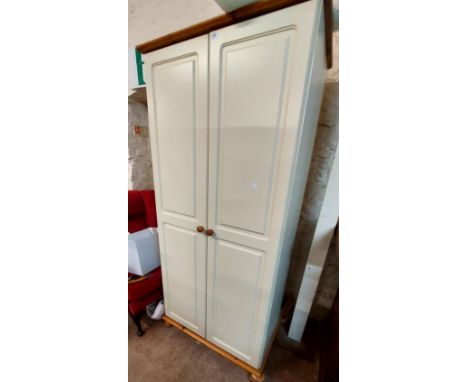 An 88cm modern part painted wardrobe with hanging space and shelf enclosed by a pair of moulded doors