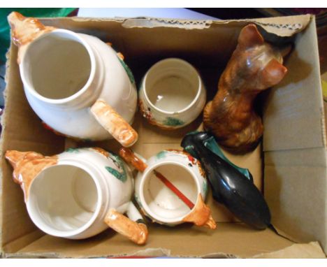 A box containing a small quantity of assorted ceramic items including Poole Pottery dolphin figurine, etc.