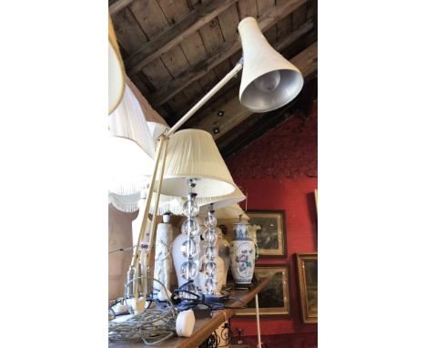 A vintage Herbert Terry anglepoise lamp with circular base and original cream paint finish