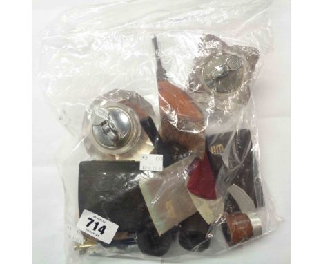 A bag containing a quantity of collectable items, including vintage pipes, lighters, etc.
