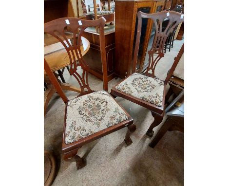 A pair of mahogany framed Chippendale style dining chairs with upholstered drop-in seats - sold with a pair of oak lathe back