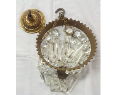 A vintage hanging ceiling light of luster drop form with cast brass gallery and hanging chains
