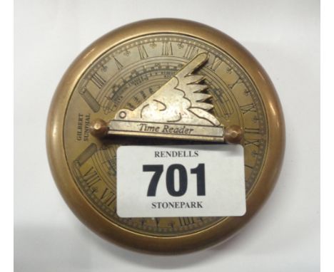 A modern reproduction brass compass with sundial to lid