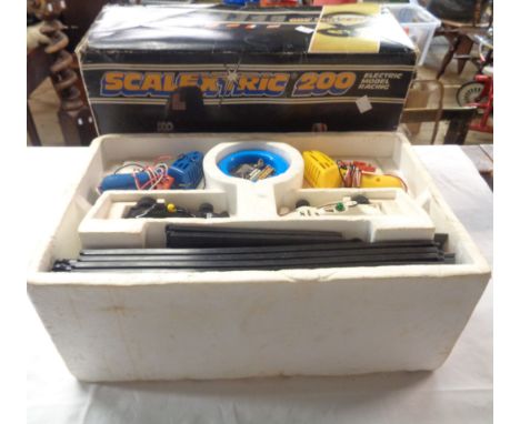 A vintage boxed Scalextric 200 set