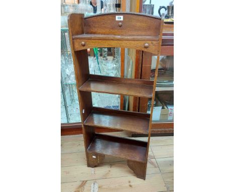 A 45.5cm early 20th Century stained oak freestanding four shelf open bookcase with brackets under