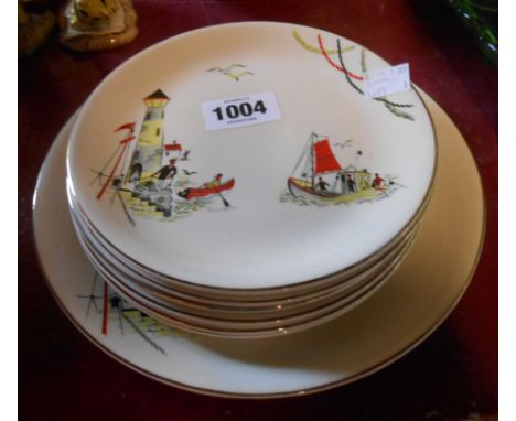 A vintage Alfred Meakin sandwich set comprising one large and six smaller plates decorated in the St. Ives pattern