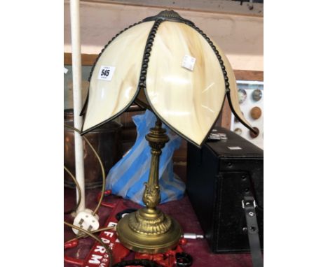 A cast brass table lamp of candlestick form with acanthus leaf decoration - sold with shade