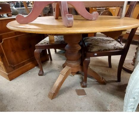 A 1.11m diameter antique pine tilt-top breakfast table, set on heavy turned pillar and tripod base - splits and other age rel