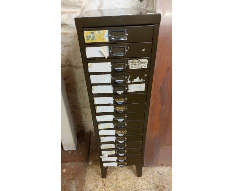 A 28cm vintage grey painted metal filing cabinet with flight of fifteen drawers, set on raised bracket feet