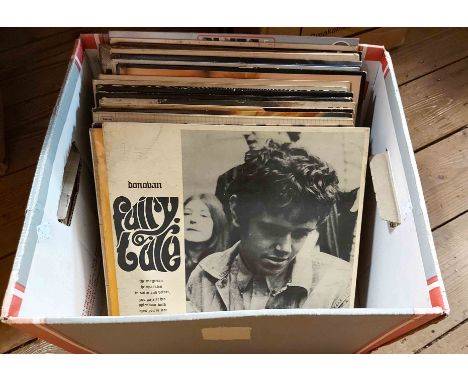 A box containing a selection of vintage LP records including Donovan, Bob Dylan, The Eagles, etc.