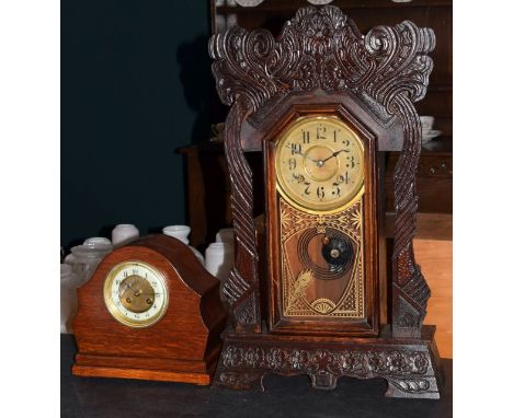Late 19th/early 20th Century Haven Clock Company 'Gingerbread' cased mantel clock, together with an early 20th Century oak ca