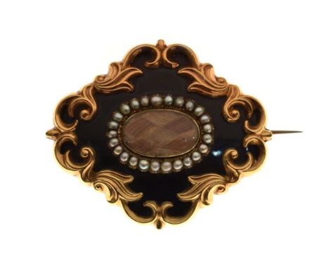 Victorian gold coloured metal mourning brooch having woven hair panel within a seed pearl border and black enamel decoration,