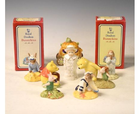 Quantity of Royal Doulton Bunnykins and Winnie The Pooh figures, 'Worcester boy with boat' candlesnuffer, Coalport pumpkin de
