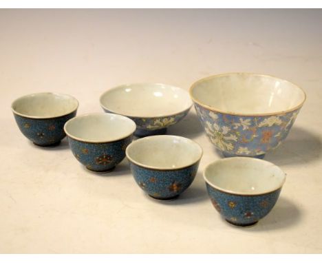 Four Japanese porcelain tea bowls having external cloisonné decoration and an enamel decorated cup and cover   Condition: 