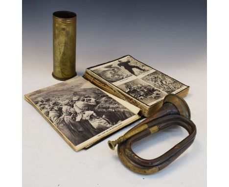 Militaria - First World War shell case decorated with oak leaves and the script '1914-18', a copper and brass bugle and book 