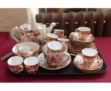 Victorian floral decorated ceramic watering can and 30 pieces orange and gilt Edwardian tea ware etc. Condition Report: see t