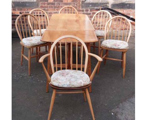 Ercol dining table complete with console style extension table and six chairs (2 carvers), the chairs bearing B.O.T. price co