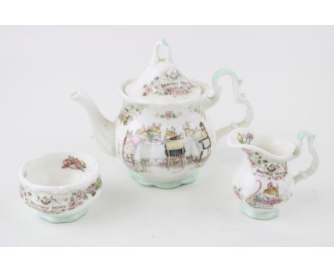 Royal Doulton Brambly Hedge miniature tea service to include a teapot, a milk jug and sugar bowl (3).  In good condition with