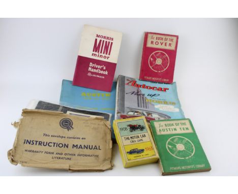 A collection of car instruction manuals and ephemera to include 'The Book of the Austin Ten', 'The Book of the Rover', 'Morri