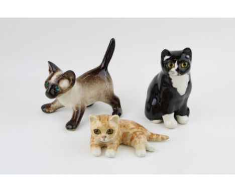 A trio of Winstanley pottery cats to include a Siamese cat, a ginger kitten and one other, 15cm tallest (3).  In good conditi