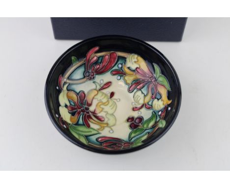 Boxed Moorcroft Honeysuckle Haven bowl, first quality, 12cm diameter.  In good condition with no obvious damage or restoratio