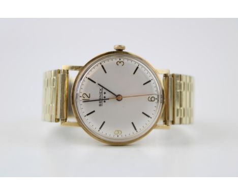 A 9ct gold vintage gentleman's 'Bernex' wristwatch, Swiss movement, Silver tone dial with applied baton markers. Arabic numer