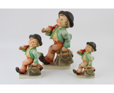 Goebel graduated set of three figures of the Merry Wanderer, tallest 25cm (3).  In good condition with no obvious damage or r