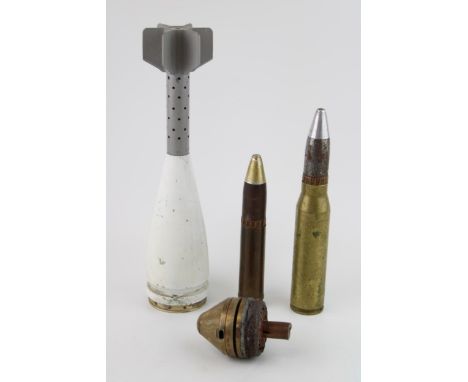 A collection of WW1 and later ordnance relics to include German Dopp Fuse two trench art bullet cases with a lighter and a mo