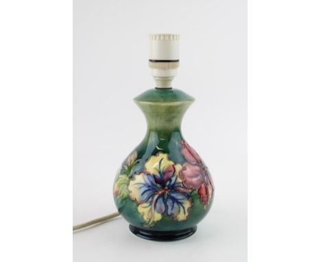 Moorcroft lampbase, Clematis pattern, 23cm tall.  In good condition with no obvious damage or restoration. Untested.