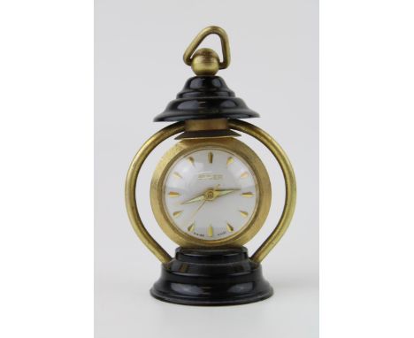 A 'Buler' manual winding miniature lantern clock. Swiss movement with glass back. Height 7cm.  Clock winds, runs and ticks do