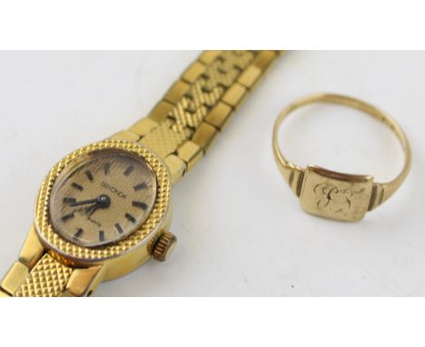 A 9ct gold signet ring (weight 1.8grams) together with a vintage cocktail watch. (2)
