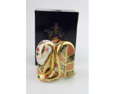 Boxed Royal Crown Derby paperweight, Old Imari Snake, first quality with gold stopper.  In good condition with no obvious dam